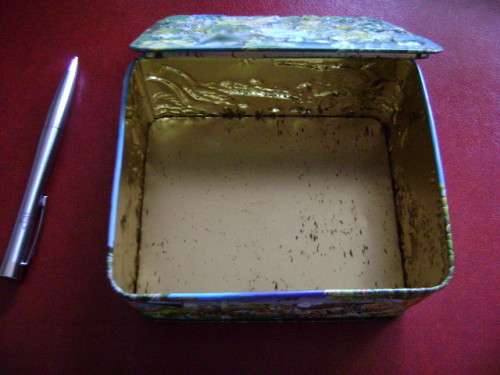 Embossed tin  with animal jungle features  (14 x 12 x 6 cm)