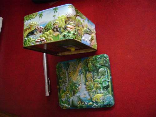 Embossed tin  with animal jungle features  (14 x 12 x 6 cm)