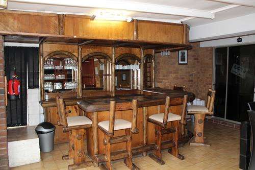 Full bar with canopy and 6 bar stools