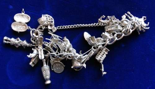 ## Sterling Silver charm Bracelett over 105grams with 30 Charms ##