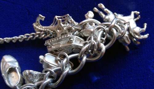 ## Sterling Silver charm Bracelett over 105grams with 30 Charms ##