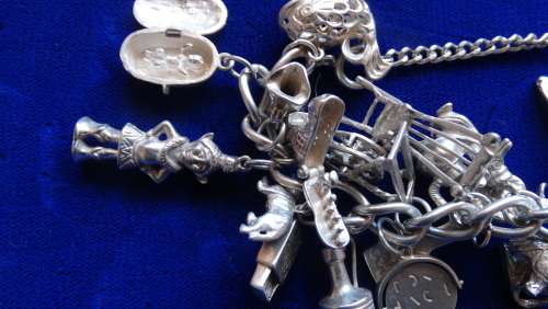 ## Sterling Silver charm Bracelett over 105grams with 30 Charms ##