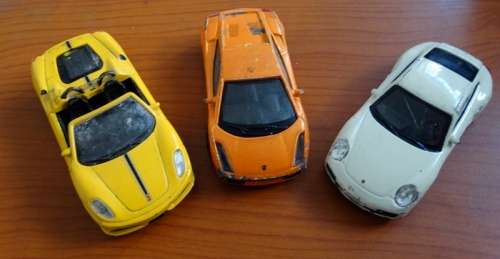 2 Bburago and 1 Uni Die Cast cars