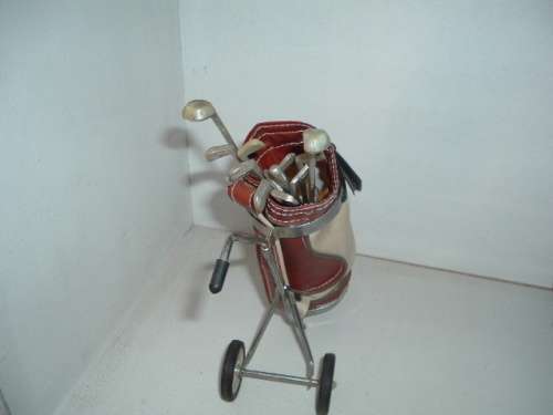 MINIATURE GOLF BAG AND CLUBS.
