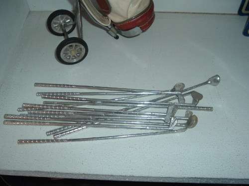 MINIATURE GOLF BAG AND CLUBS.