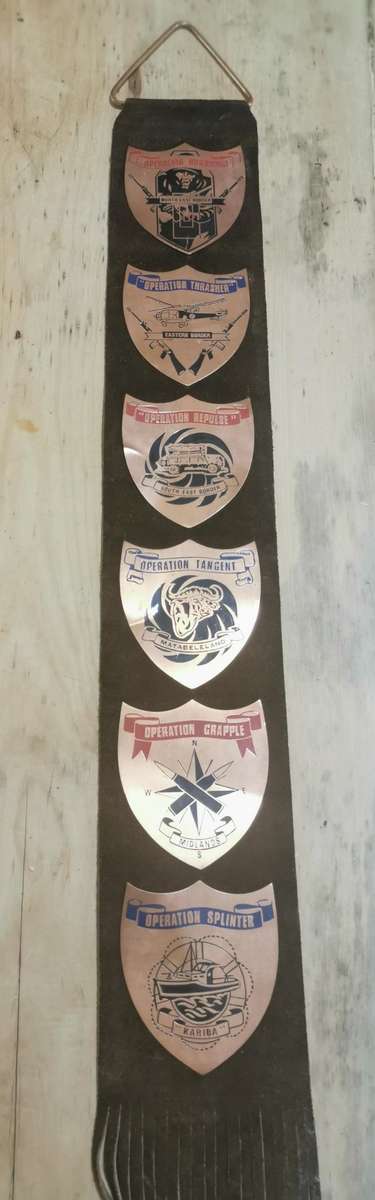 Rare Rhodesia hanging leather strap with 6 military operation copper plaques