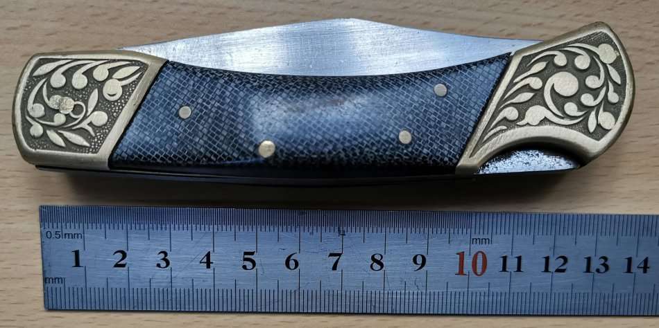 Large vintage stainless steel lock knife with snakeskin pattern handle