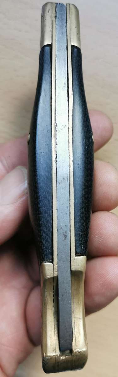 Large vintage stainless steel lock knife with snakeskin pattern handle