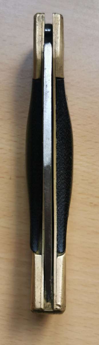 Large vintage stainless steel lock knife with snakeskin pattern handle