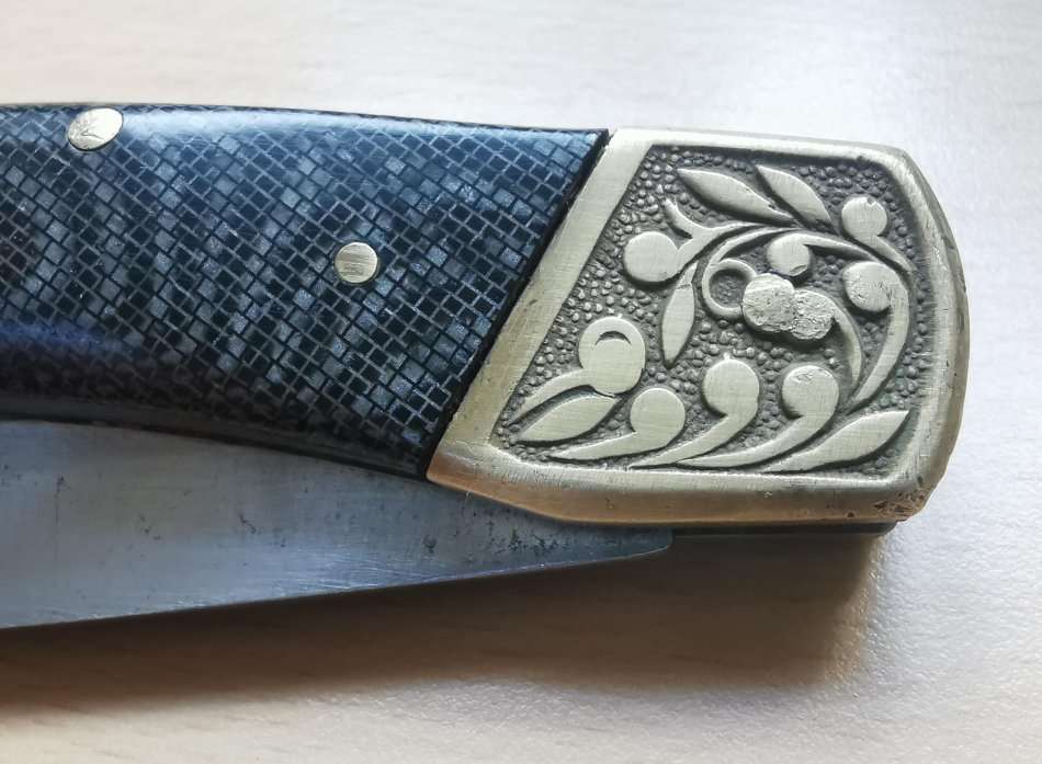 Large vintage stainless steel lock knife with snakeskin pattern handle