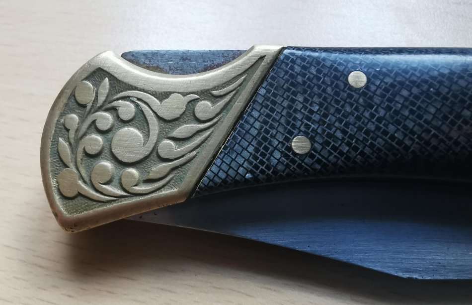 Large vintage stainless steel lock knife with snakeskin pattern handle