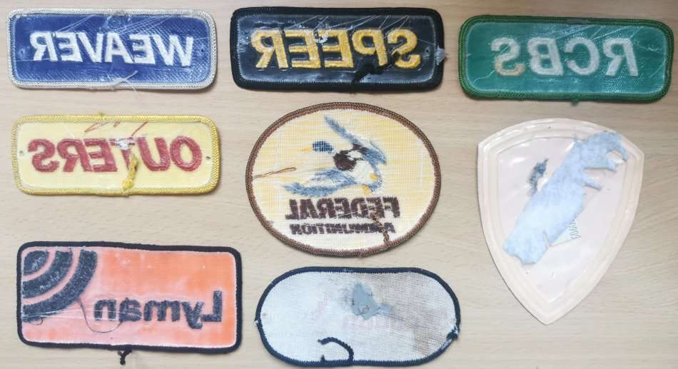 Great lot of 8 vintage badges related to arms and ammunition - most embroidered