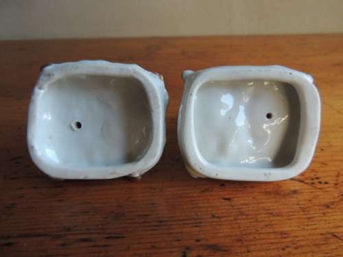 PAIR OF ENAMEL GLAZED CATS ON CUSHIONS