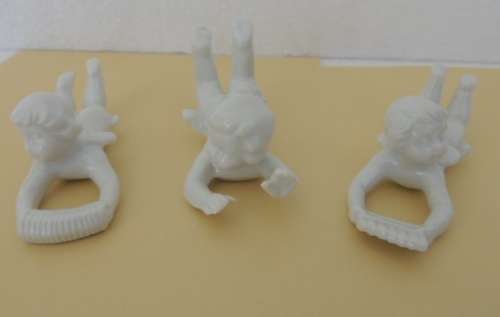 TRIO OF PORCELAIN CHERUBS