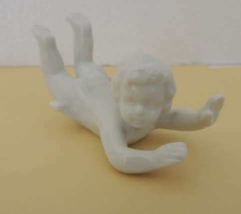 TRIO OF PORCELAIN CHERUBS