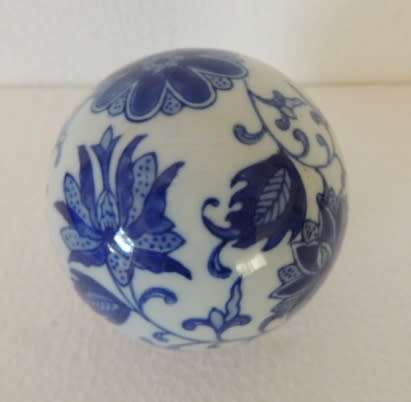 BLUE AND WHITE DECOR BALLS IN A BOWL
