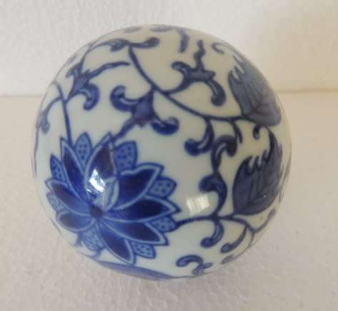 BLUE AND WHITE DECOR BALLS IN A BOWL
