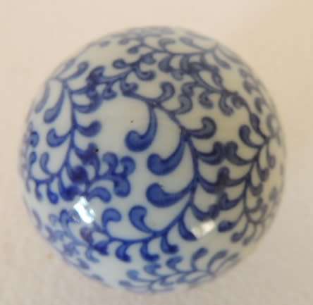 BLUE AND WHITE DECOR BALLS IN A BOWL