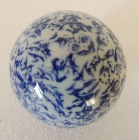 BLUE AND WHITE DECOR BALLS IN A BOWL