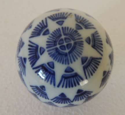 BLUE AND WHITE DECOR BALLS IN A BOWL