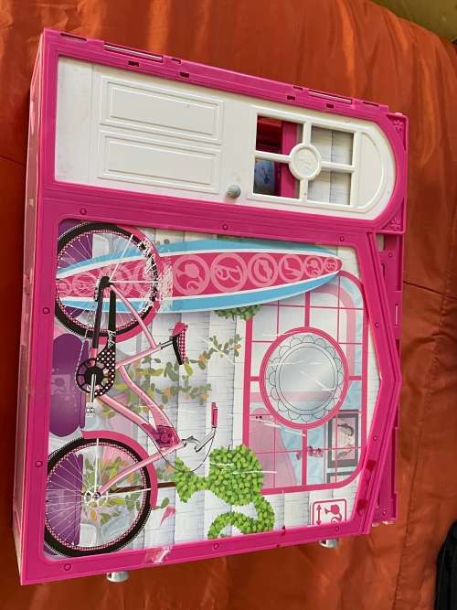 Barbie carry case and clothes as shown