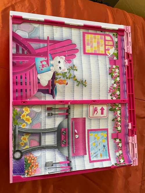 Barbie carry case and clothes as shown