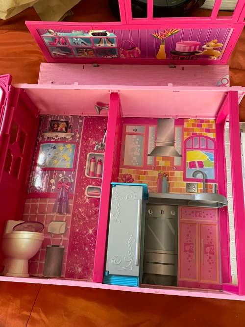 Barbie carry case and clothes as shown
