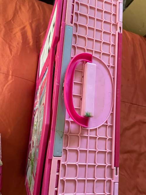 Barbie carry case and clothes as shown
