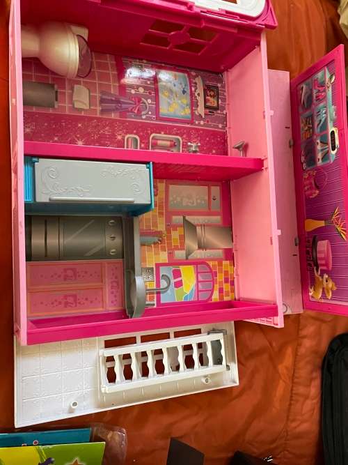 Barbie carry case and clothes as shown