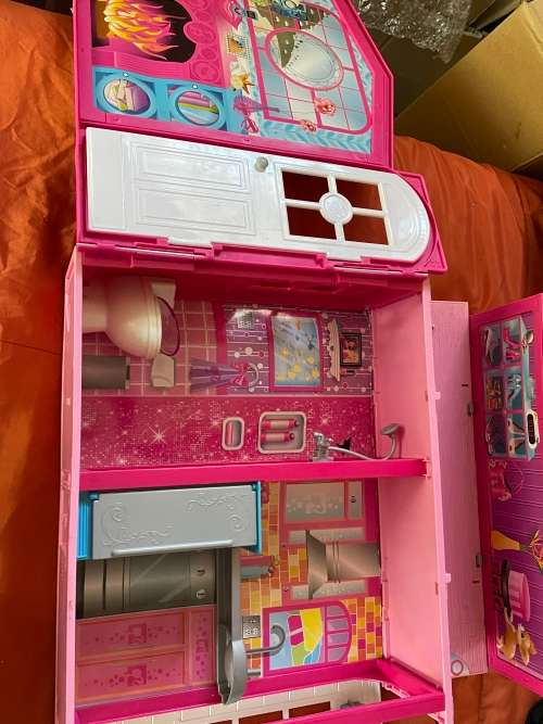 Barbie carry case and clothes as shown