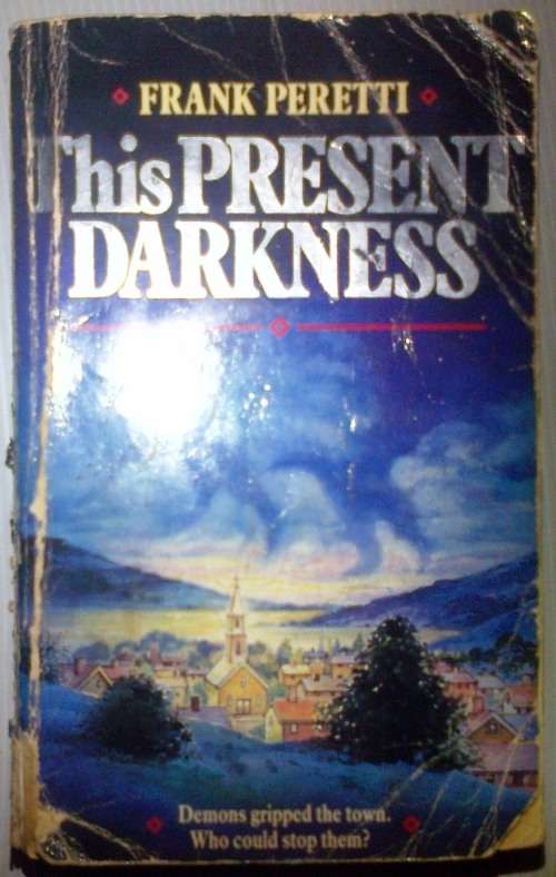 This Present Darkness by Frank Peretti Softcover