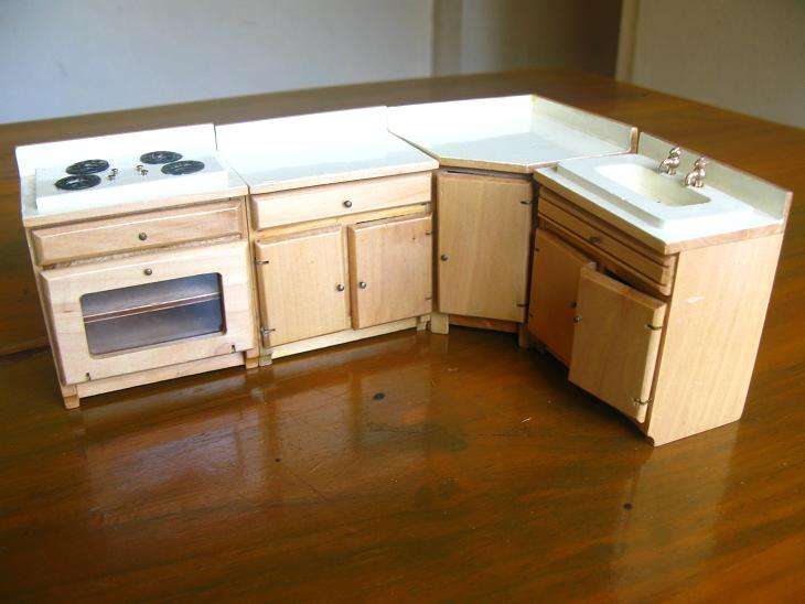 KITCHEN UNITS WITH STOVE, CUPBOARDS AND SINK -
