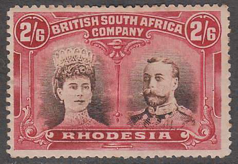 RHODESIA 1910 DOUBLE HEADS 2/6d SEPIA AND DEEP CRIMSON SG 156 FINE MINT. C/V R3200