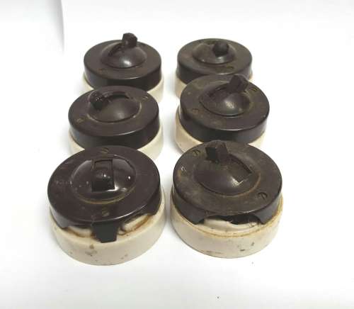 Vintage porcelain and bakelite light switches.