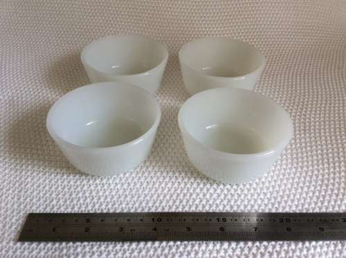 Stunning set of four milk glass bowls