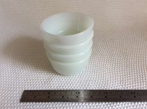 Stunning set of four milk glass bowls