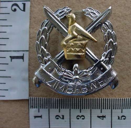 Zimbabwe Infantry cap badge, worn from 1980, both lugs intact, made by Reuteler Mfg Salisbury