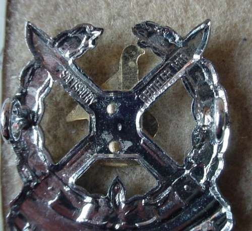 Zimbabwe Infantry cap badge, worn from 1980, both lugs intact, made by Reuteler Mfg Salisbury