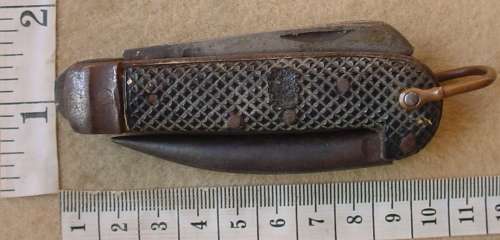 SA UDF Army issue clasp knife with can opener, marlin spike, blade marked SSP 1940 and Broad Arrow