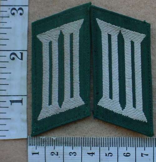 East German Police collar badges, one with a bit of glue residue on the back (DDR)