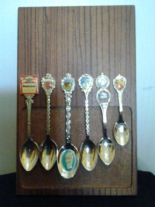 SET OF COLLECTABLE SPOONS ON MAGNETIC MOUNTED WOODEN BOARD