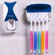 Toothpaste Dispenser and Toothbrush Holder