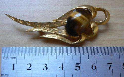 Vintage Tiger's eye brooch in an art deco-style setting