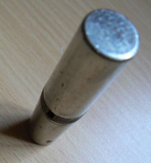 Vintage compact multitool with four bits plus tweezer