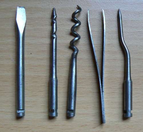 Vintage compact multitool with four bits plus tweezer