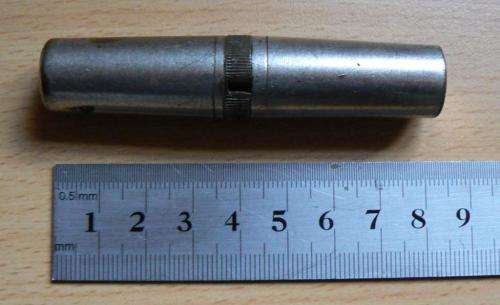 Vintage compact multitool with four bits plus tweezer