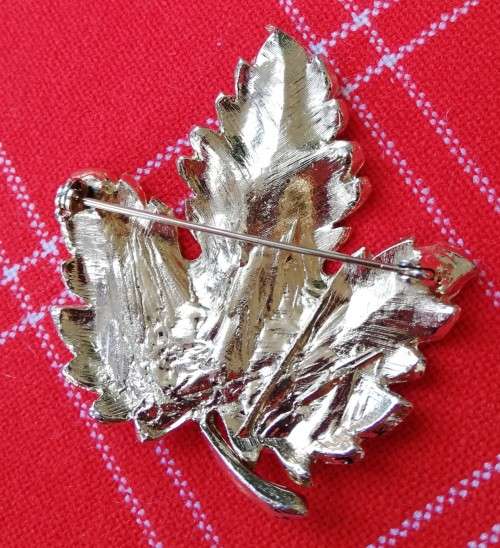 Vintage gold-coloured heavy leaf brooch