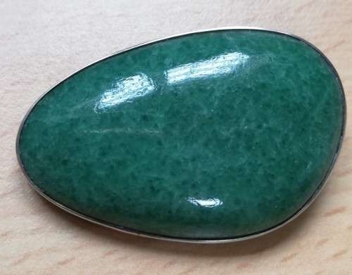 Vintage silver brooch with green semi-precious stone