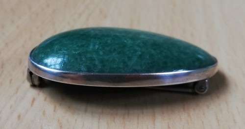 Vintage silver brooch with green semi-precious stone