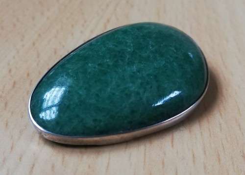 Vintage silver brooch with green semi-precious stone